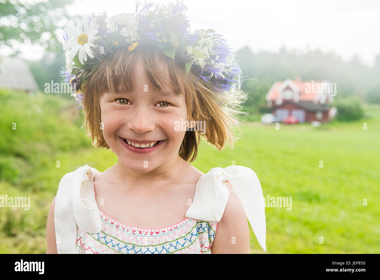 Portrait of girl wearing flower wreath Stock Photo - Alamy