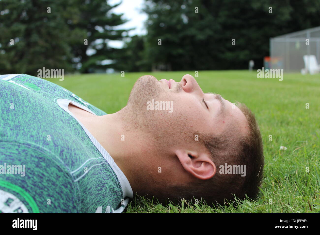 Looking up with closed eyes. Stock Photo
