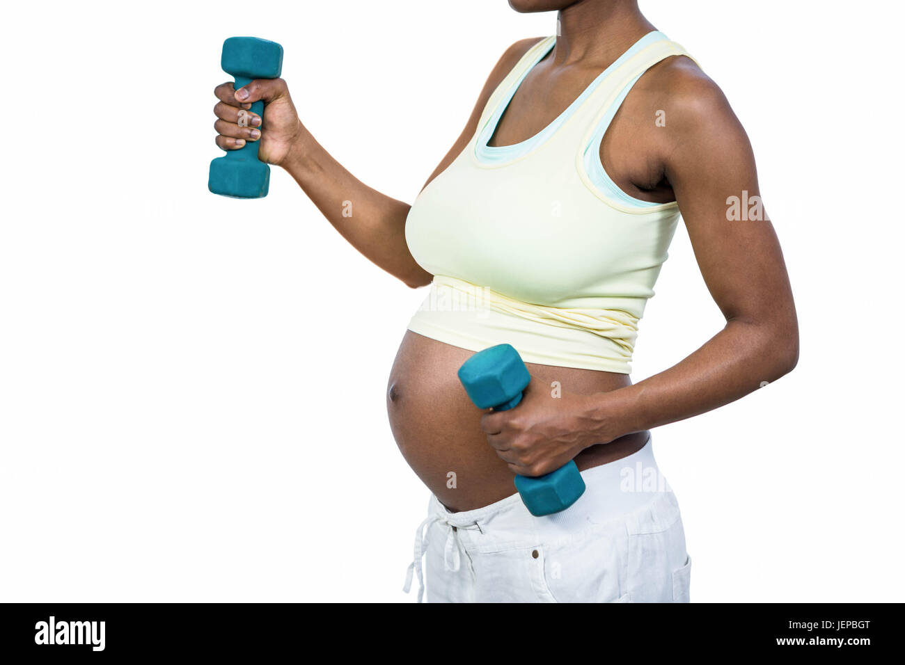 Pregnant woman lifting dumbbell Stock Photo Alamy