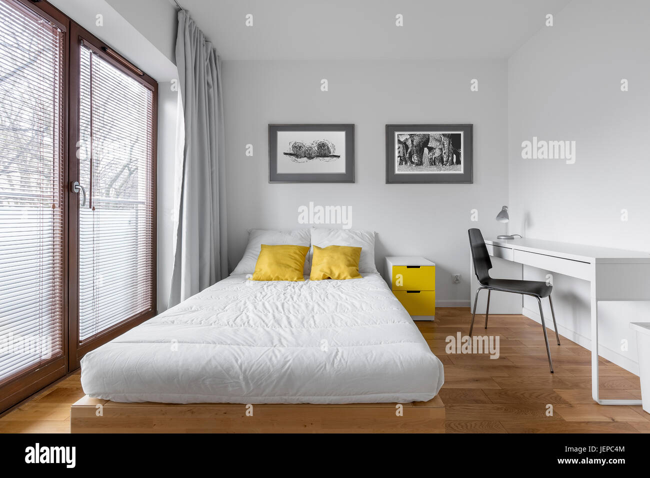 Functional White Bedroom With Bed And Modern Countertop