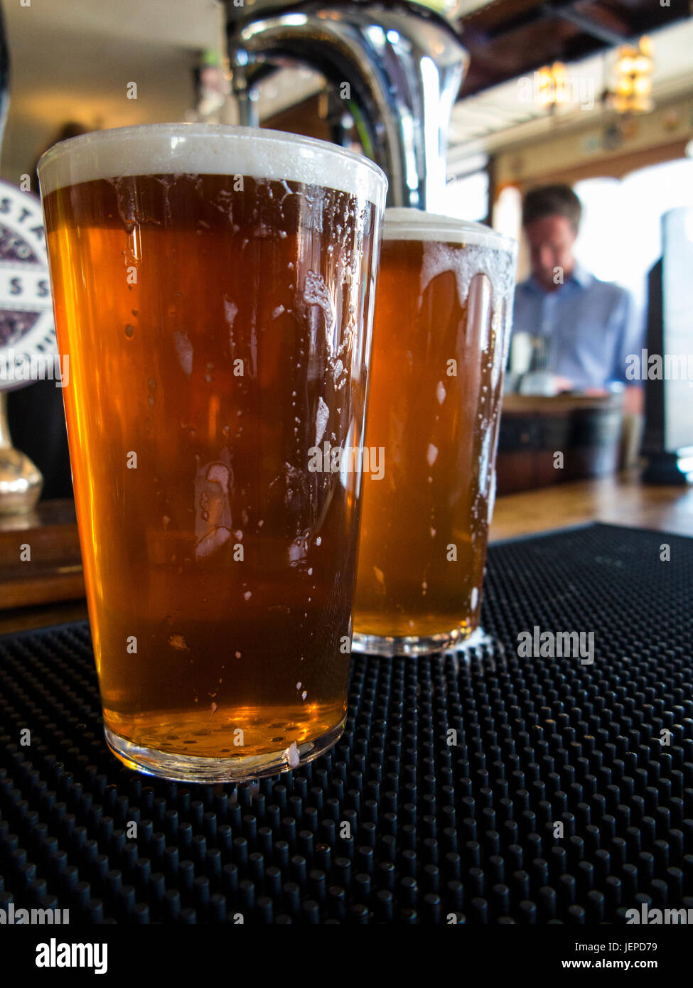 TWO PINTS OF BITTER AWAIT DRINKING IN A LONDON PUB Stock Photo
