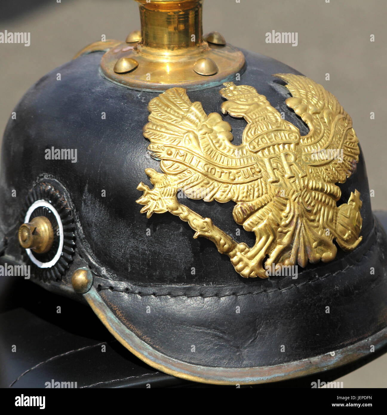 Closeup of a German WW1 Pickelhaube showing the emblem and motto 'MIT GOTT FÜR KOENIG UND VATERLAND' (With God For King And Fatherland) Stock Photo