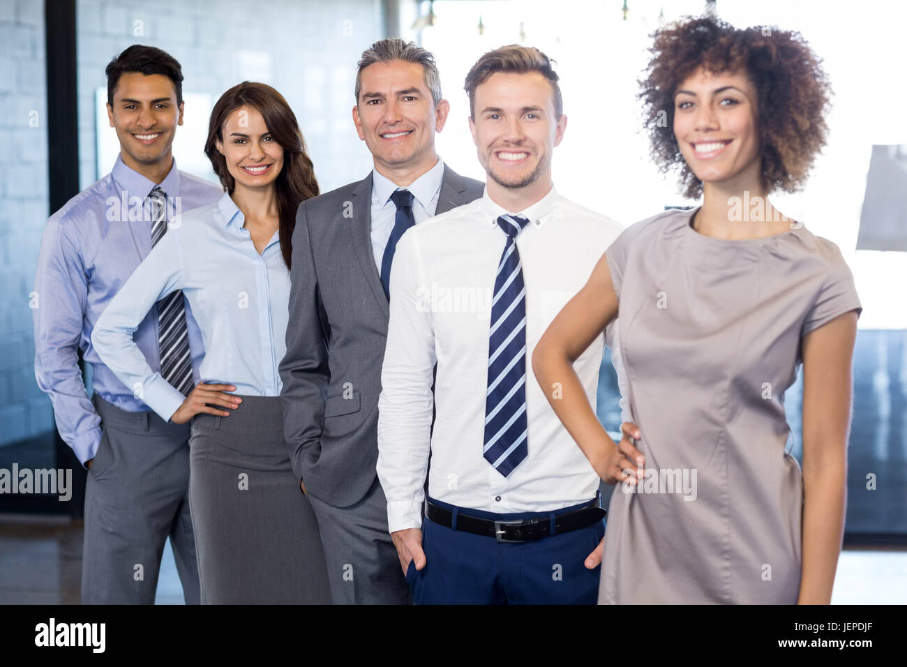 Portrait of confident business team Stock Photo - Alamy