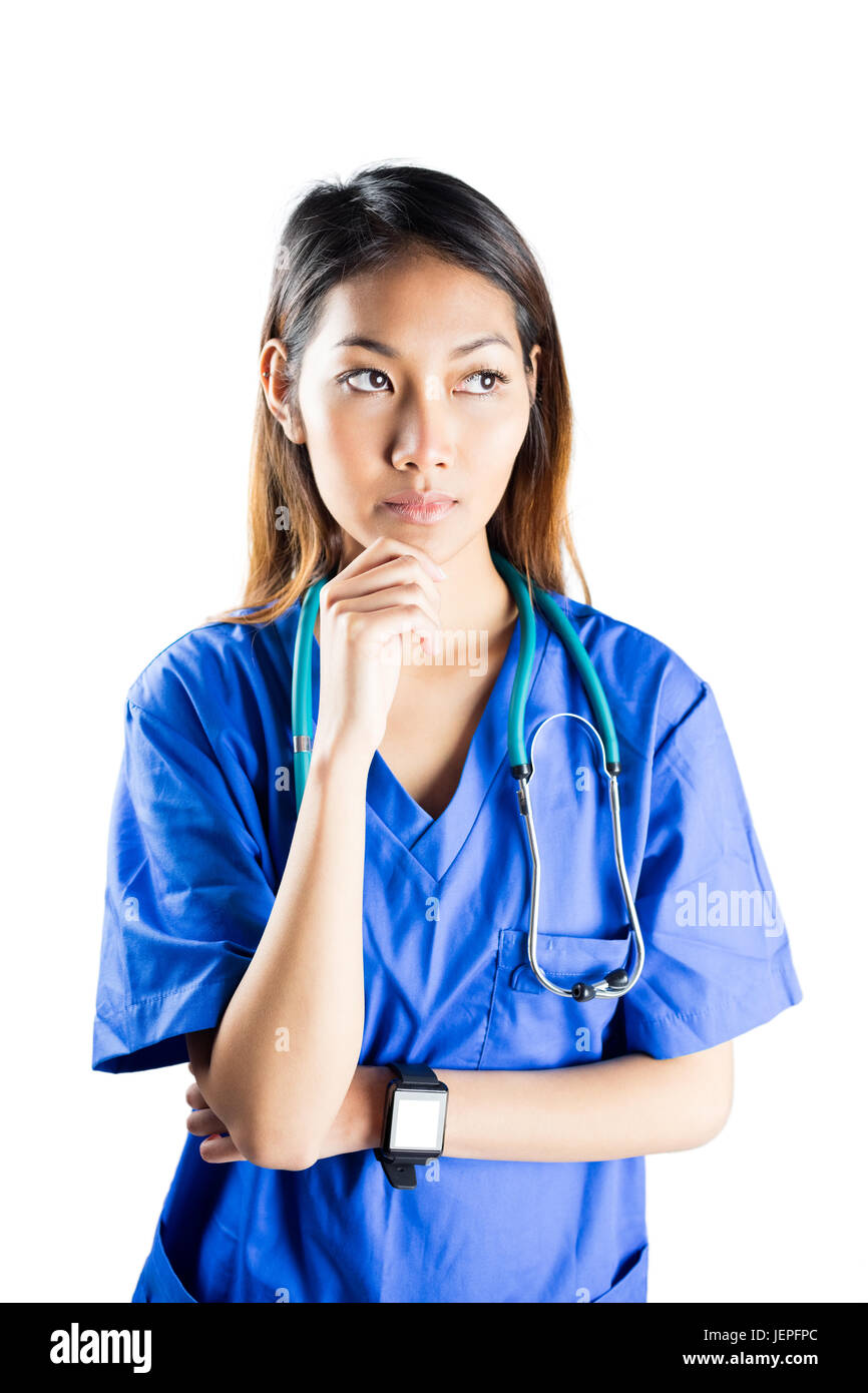 Asian nurse thinking with hand on chin Stock Photo Alamy
