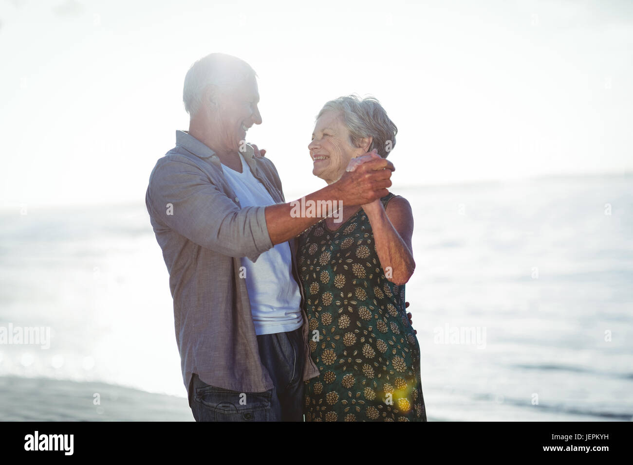 Senior couple dancing at the beach Stock Photo - Alamy