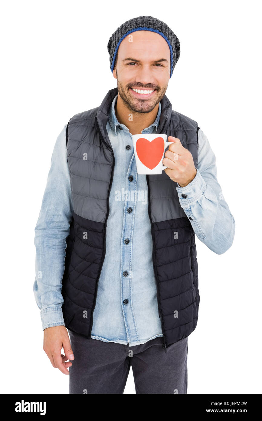 Happy young man holding coffee mug Stock Photo