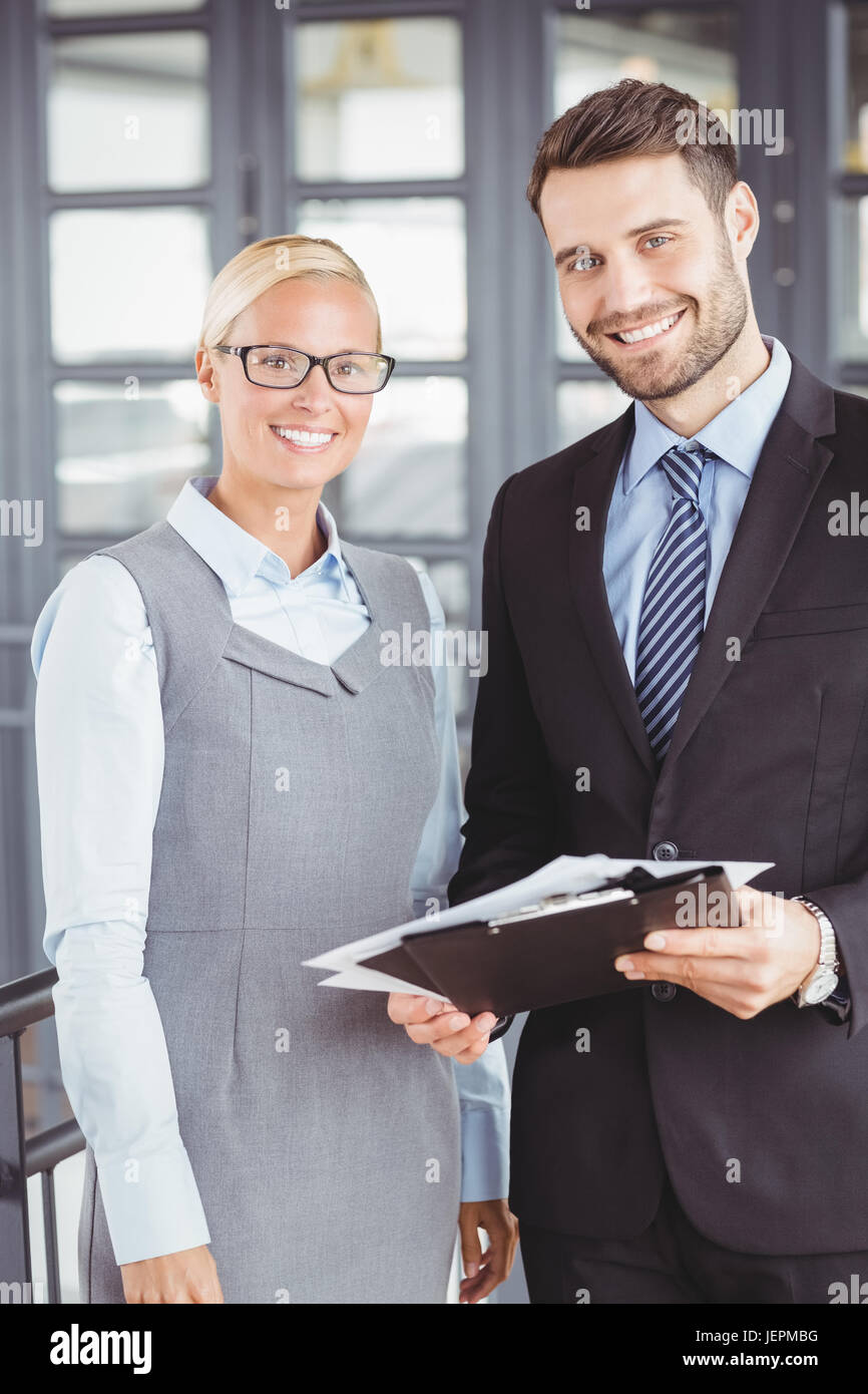 Happy business people with documents Stock Photo - Alamy