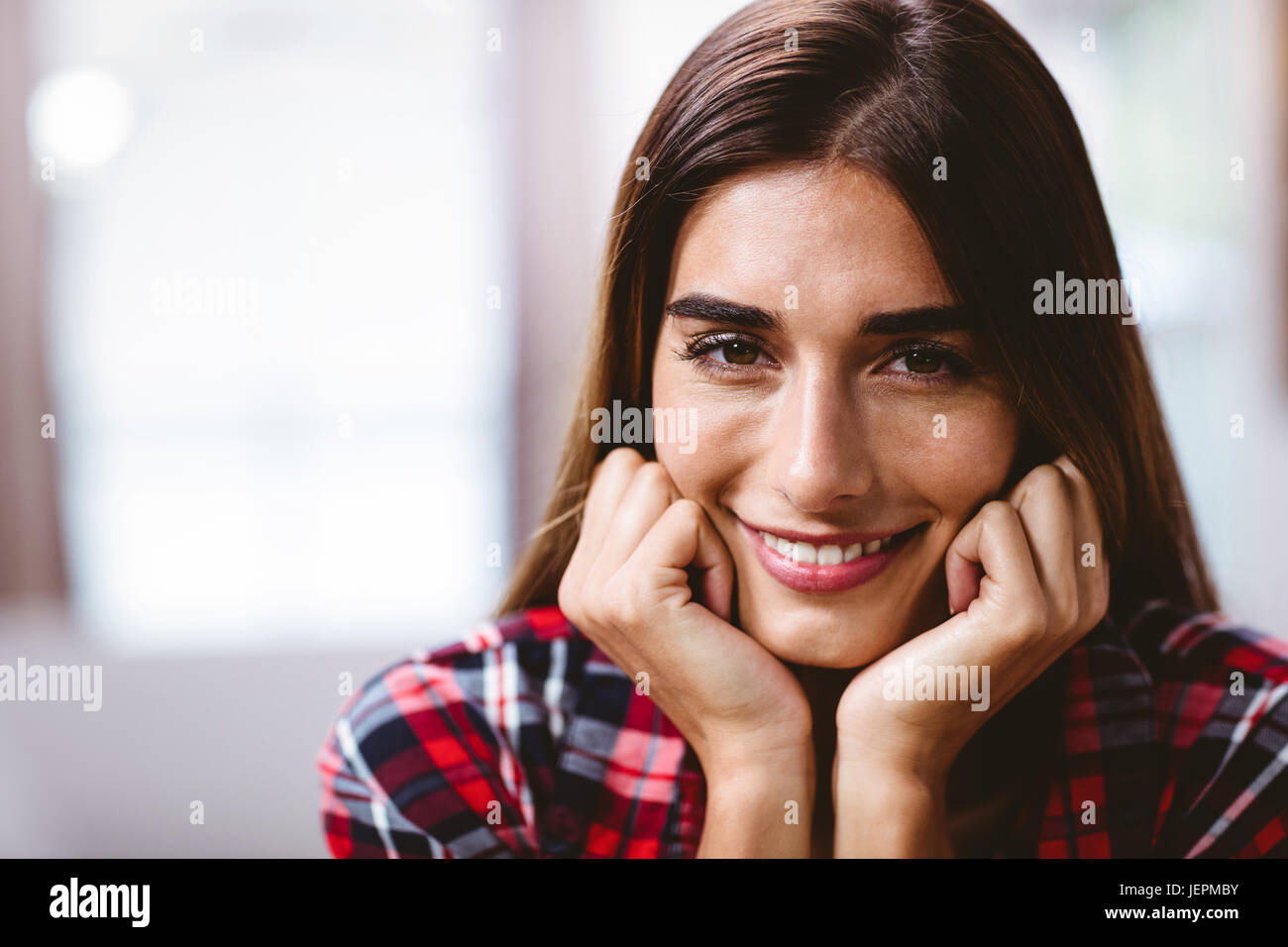 Close-up portrait of smiling young woman Stock Photo - Alamy