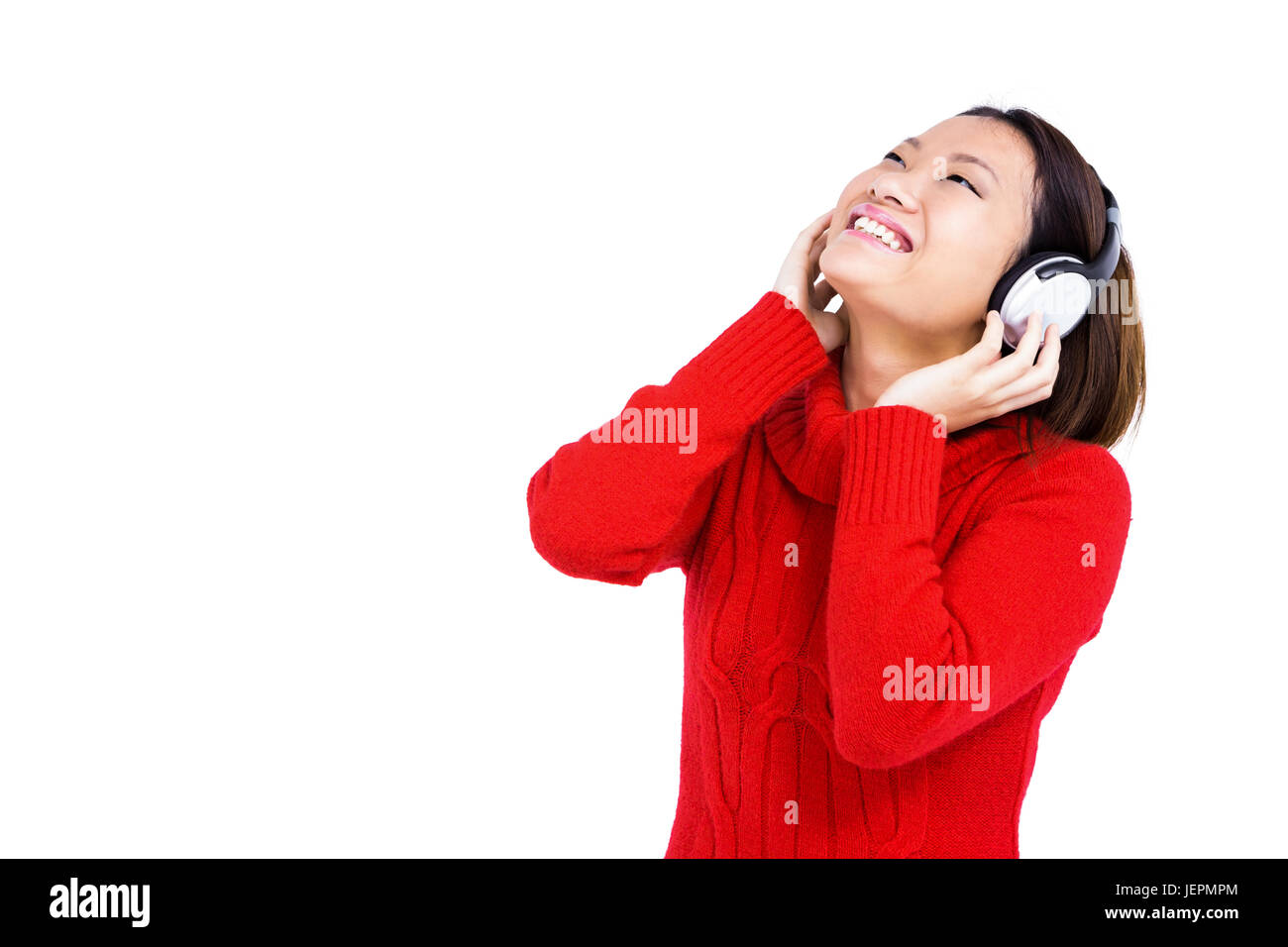 Young woman listening to music on headphone Stock Photo