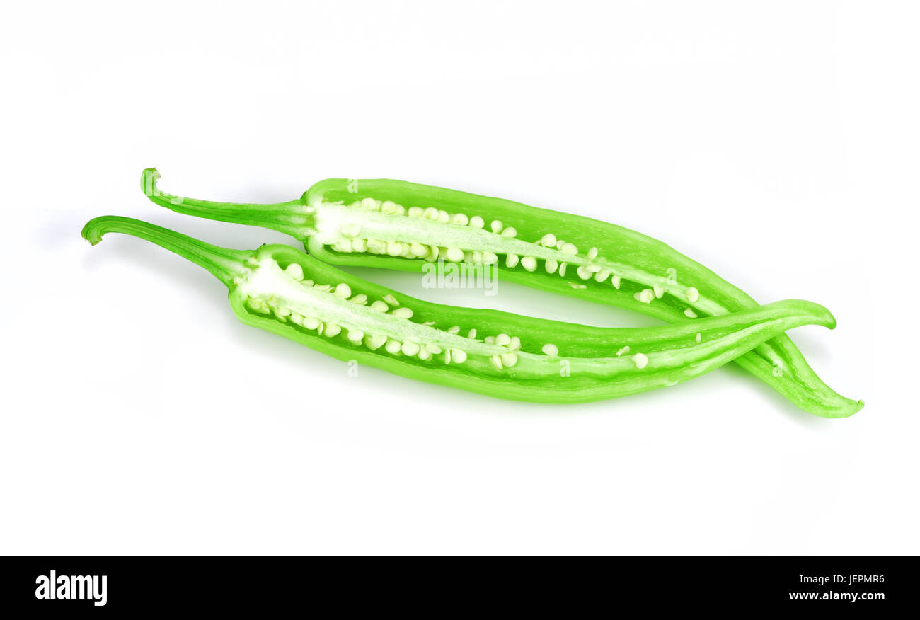 chilli slice, Green peppers and cut in half on white background Stock