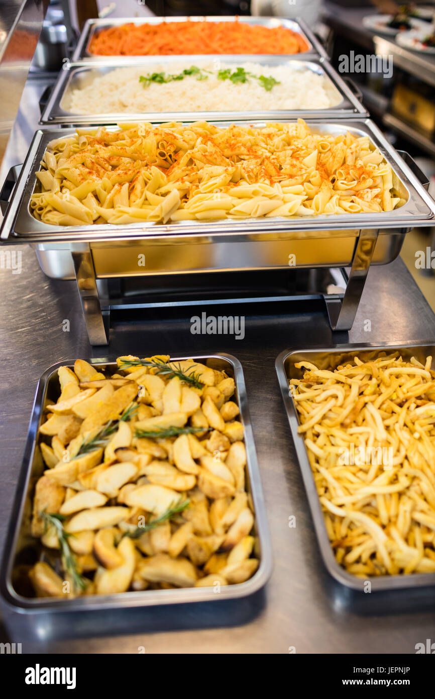 Serving dishes of potato and pasta Stock Photo Alamy