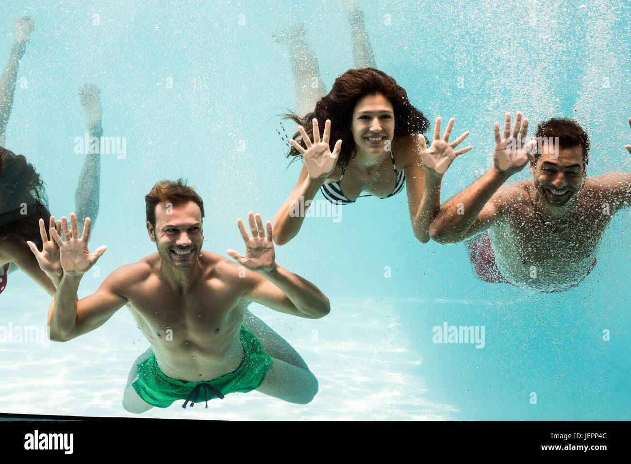 Cheerful friends swimming Stock Photo Alamy