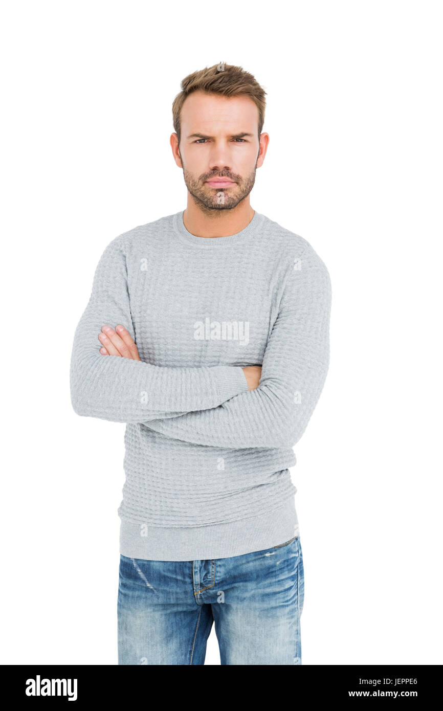 Serious man standing with arms crossed Stock Photo - Alamy