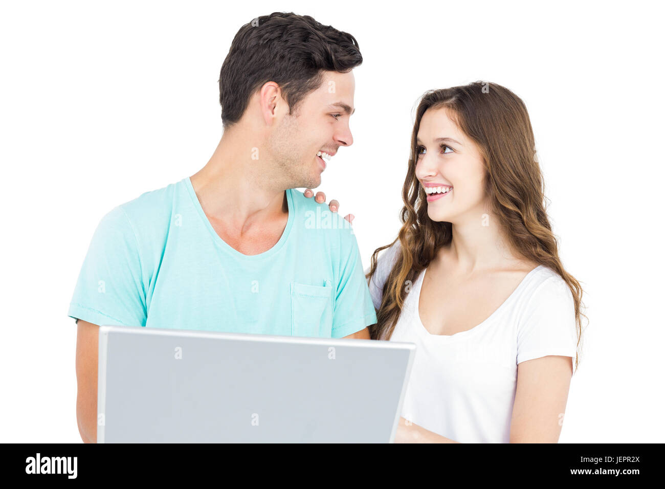 Happy couple using a laptop Stock Photo - Alamy
