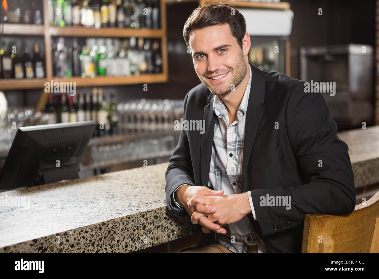 Handsome man looking at camera Stock Photo - Alamy