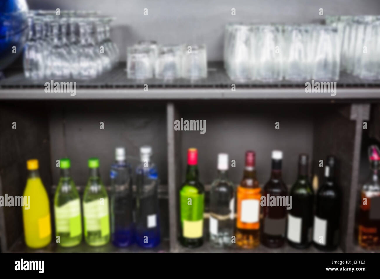 Alcohol bottles kept in a shelf Stock Photo Alamy