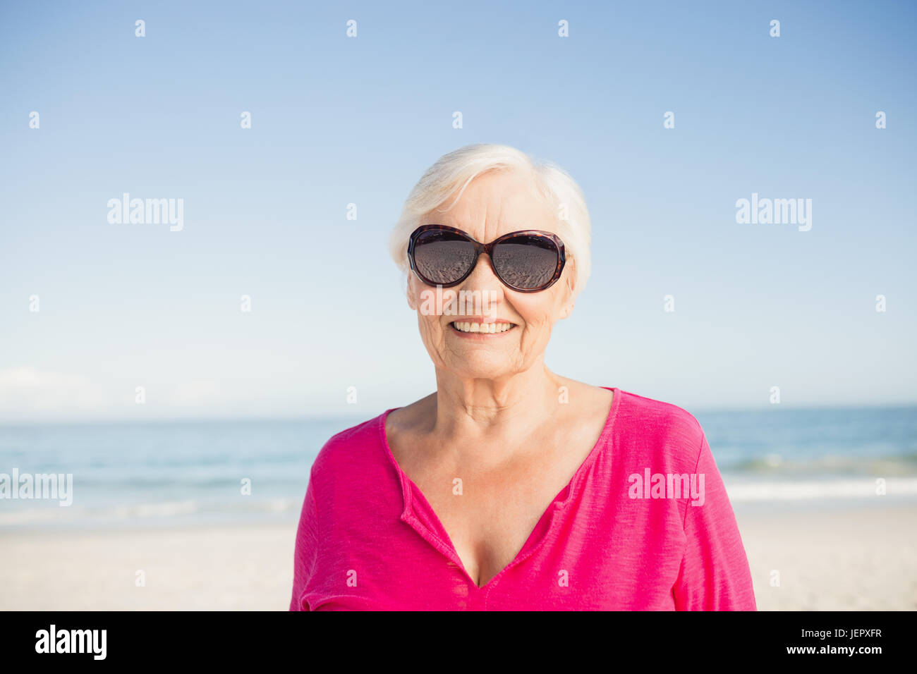 Portrait of smiling senior woman Stock Photo - Alamy