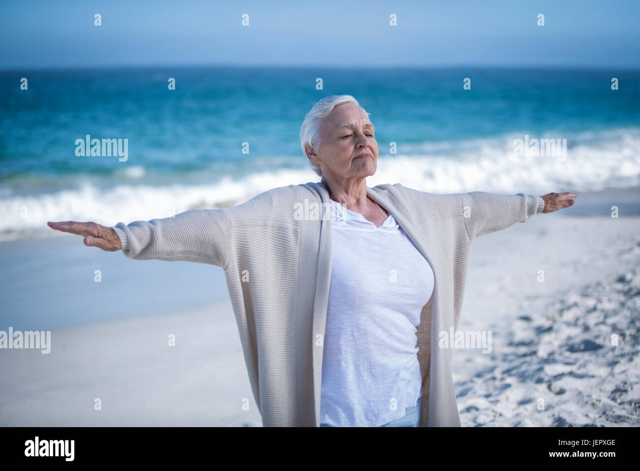 Mature woman outstretching arms hi-res stock photography and images - Alamy