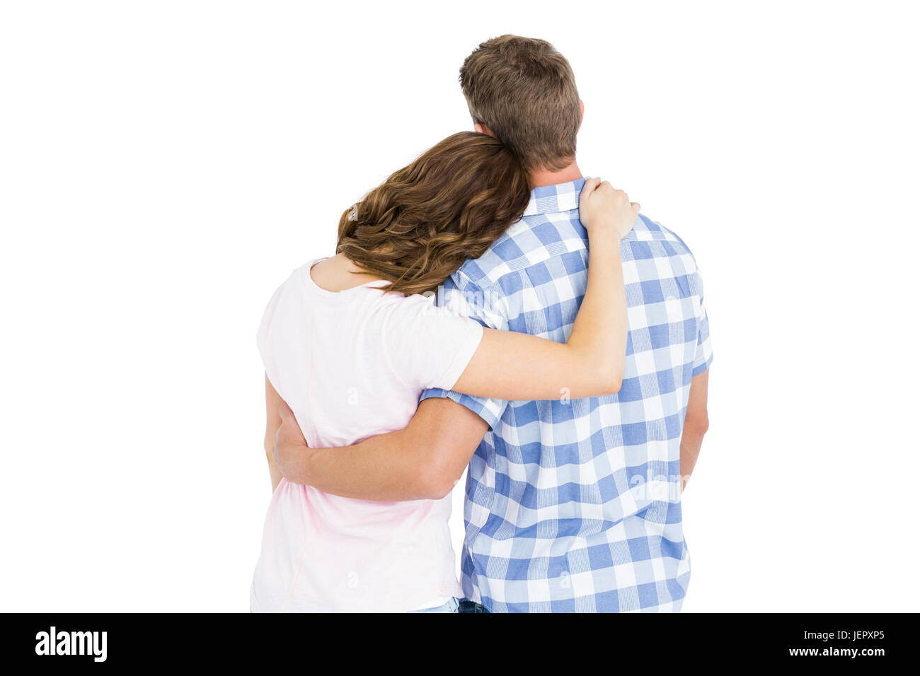 Rear view of young couple embracing Stock Photo - Alamy