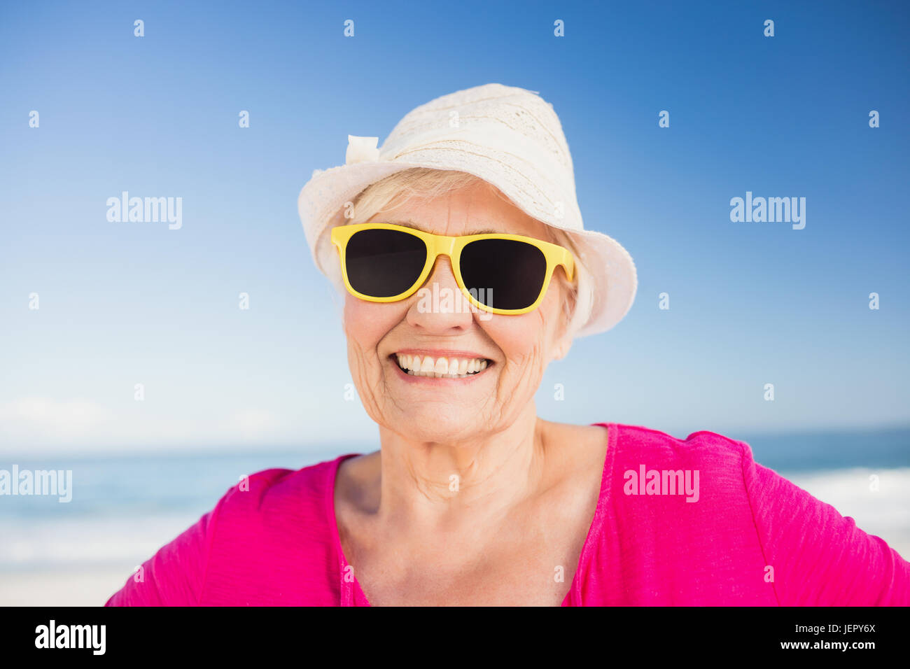 Portrait of smiling senior woman Stock Photo - Alamy