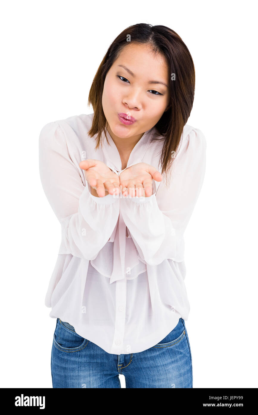 Young woman blowing a kiss Stock Photo Alamy
