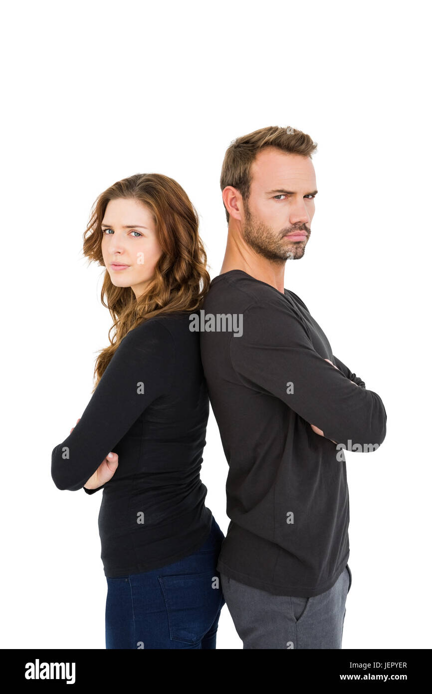 Depressed couple standing back to back Stock Photo