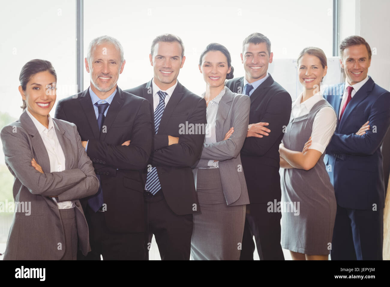 Team of businesspeople posing together Stock Photo - Alamy