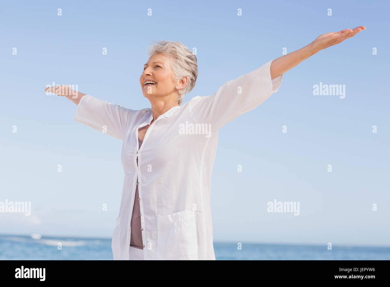 Woman arms outstretched head back hi-res stock photography and images ...