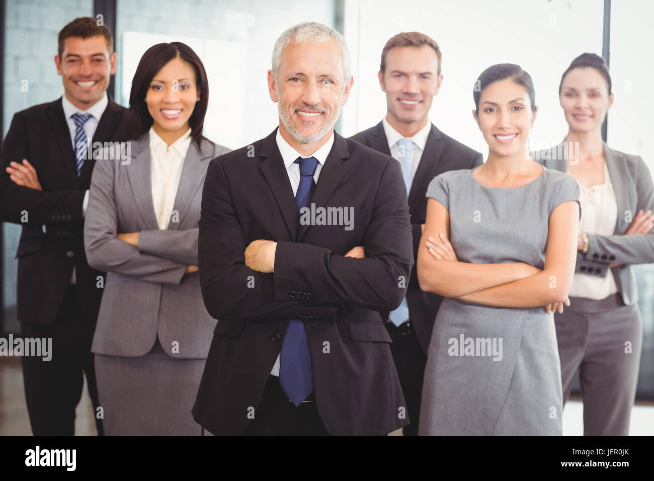 Portrait of confident business team Stock Photo - Alamy