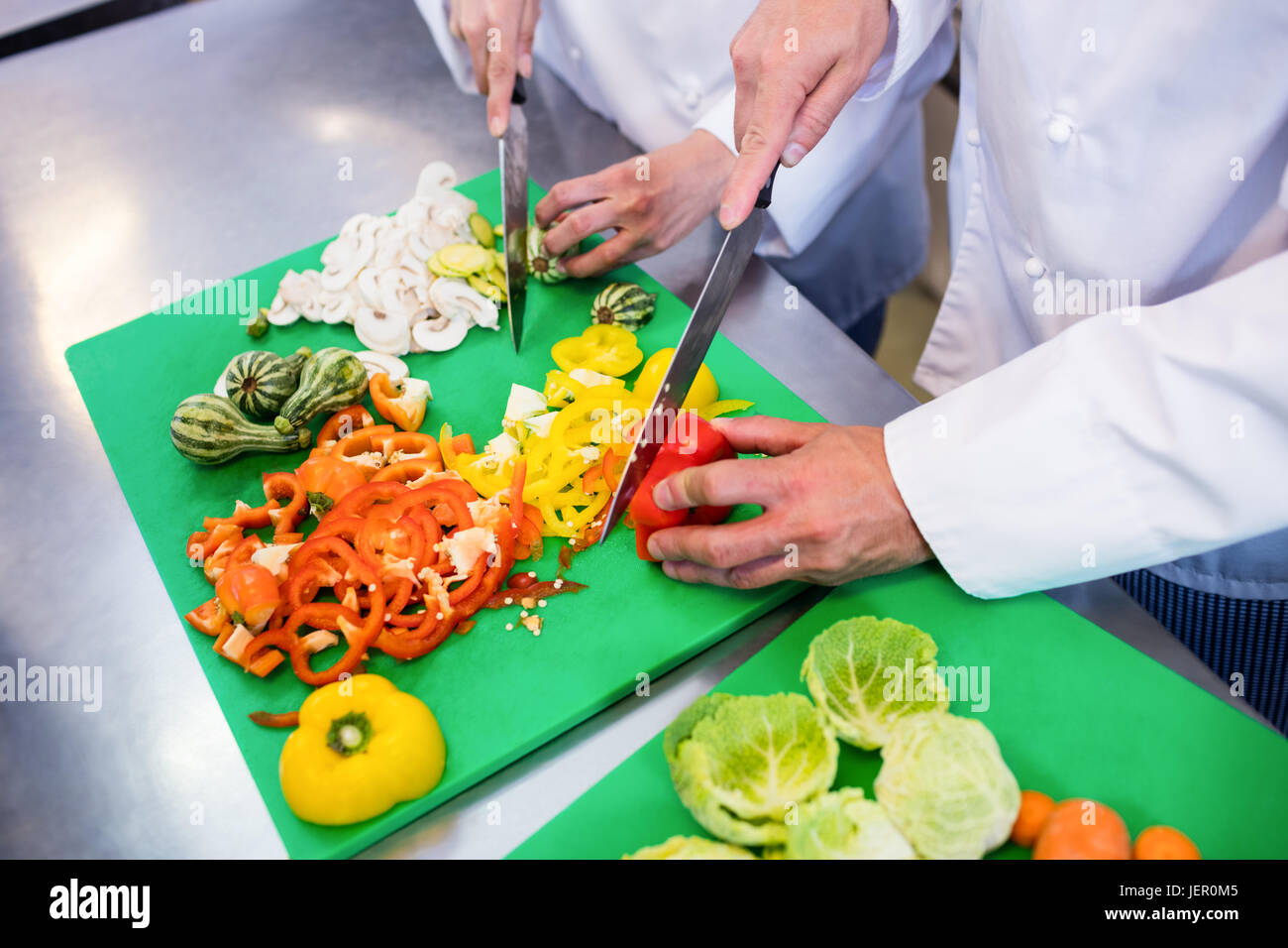 Closeup of chefs chopping vegetables Stock Photo Alamy