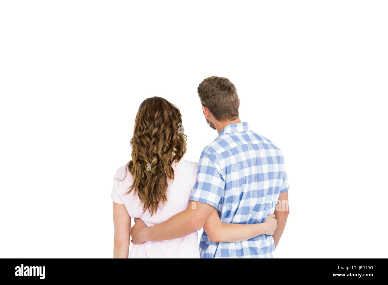 Rear view of young couple embracing Stock Photo - Alamy