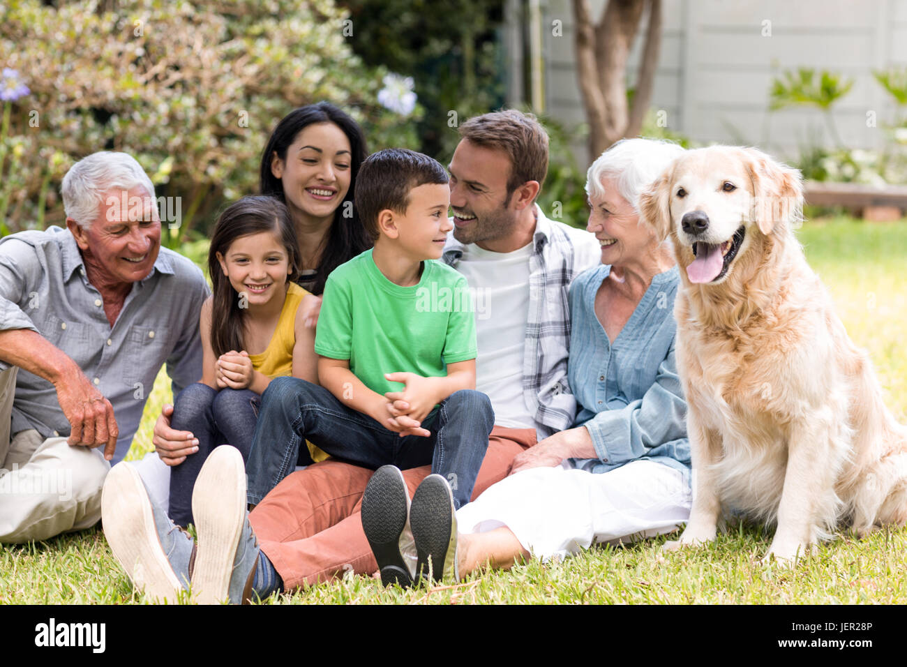Happy family in a park Stock Photo - Alamy