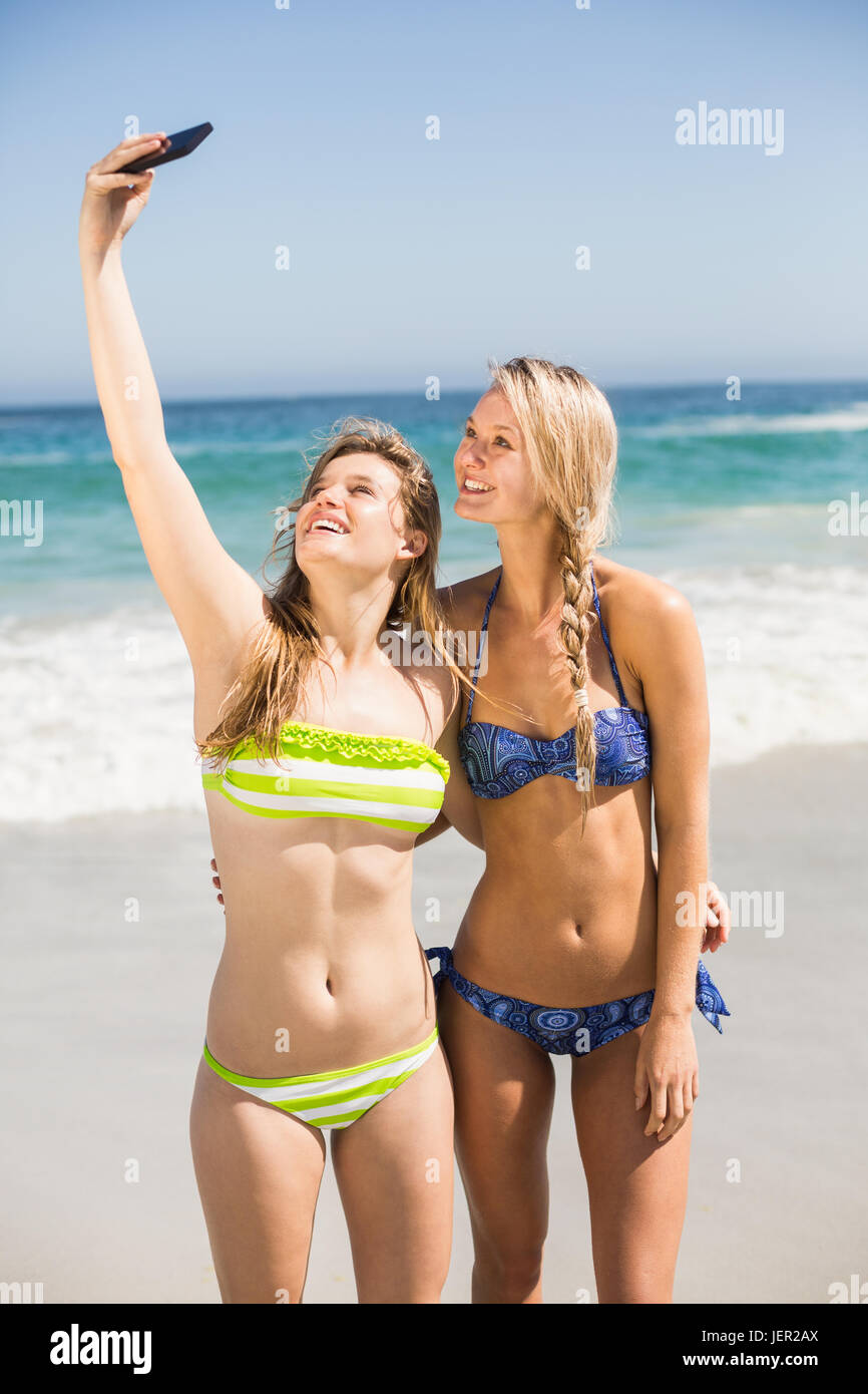 Two friends in bikini taking hi-res stock photography and images - Alamy