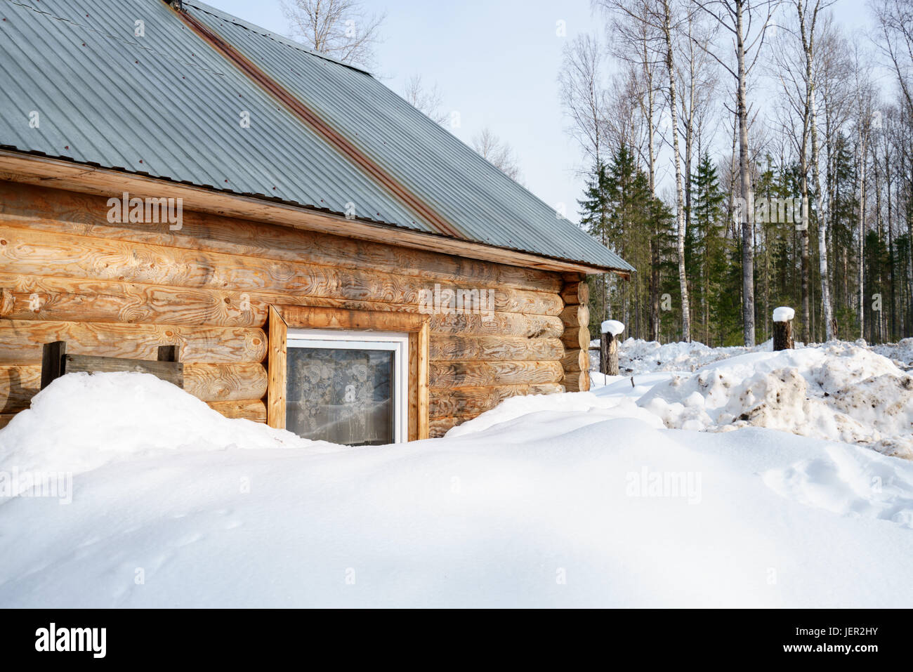 Log house covered with snow in forest Stock Photo - Alamy