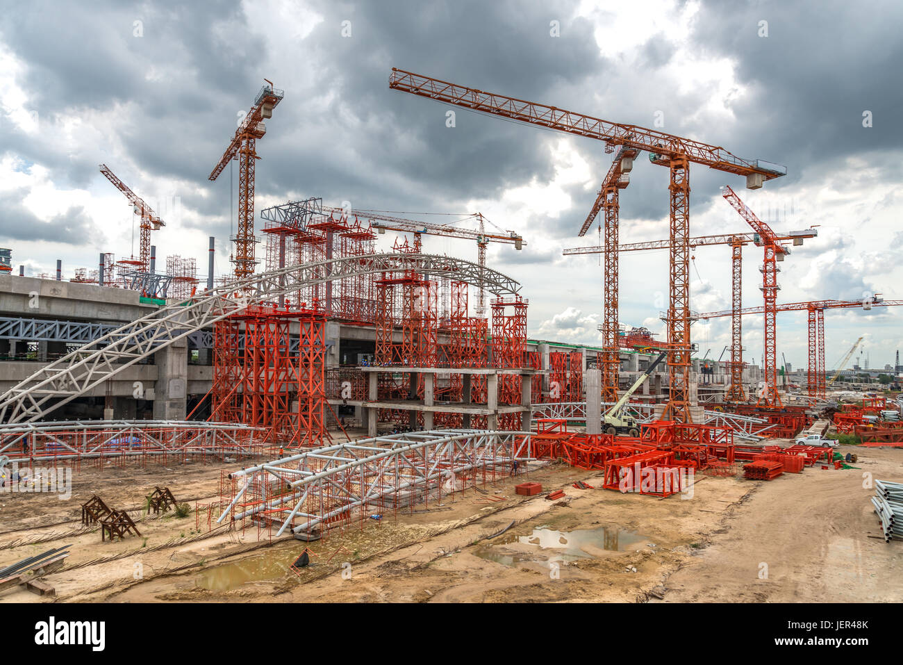 Construction Cranes Working on Expressway Site in Asia Stock Photo