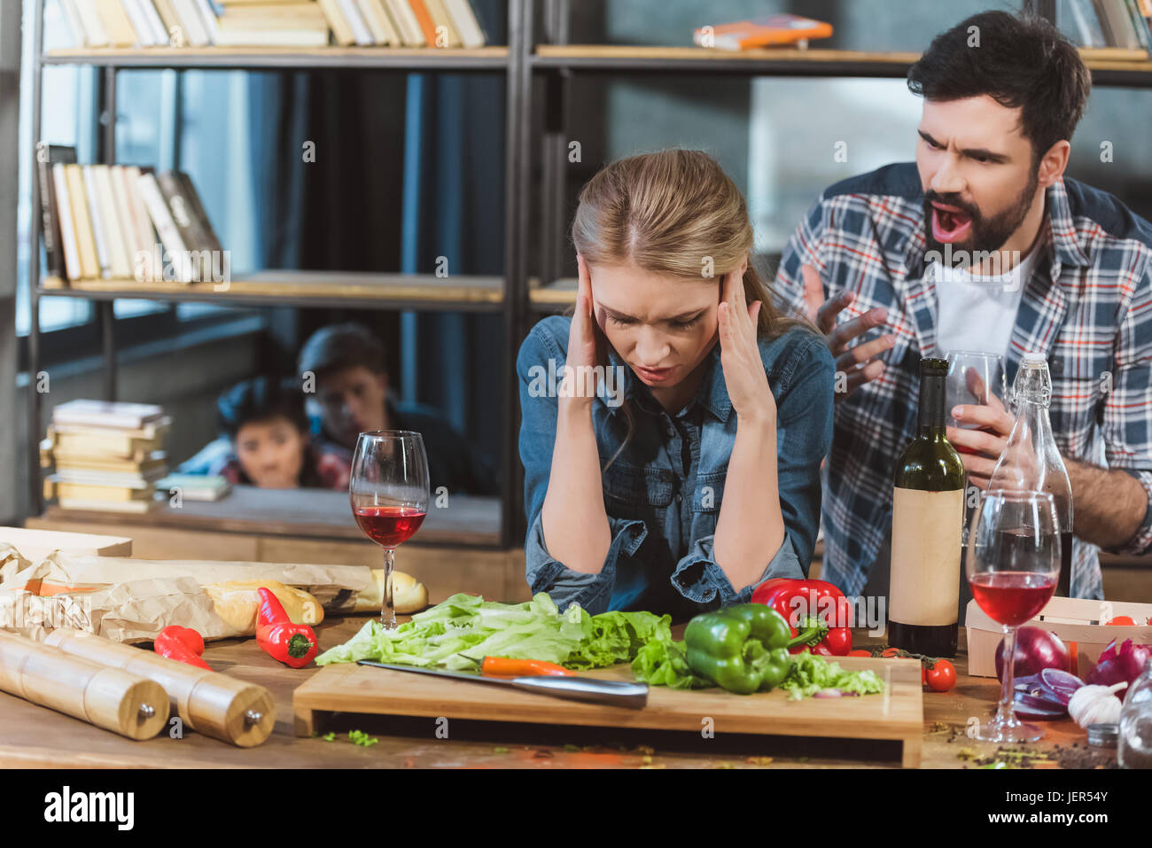 Young couple quarrel, boyfriend yelling on his sad girlfriend Stock Photo