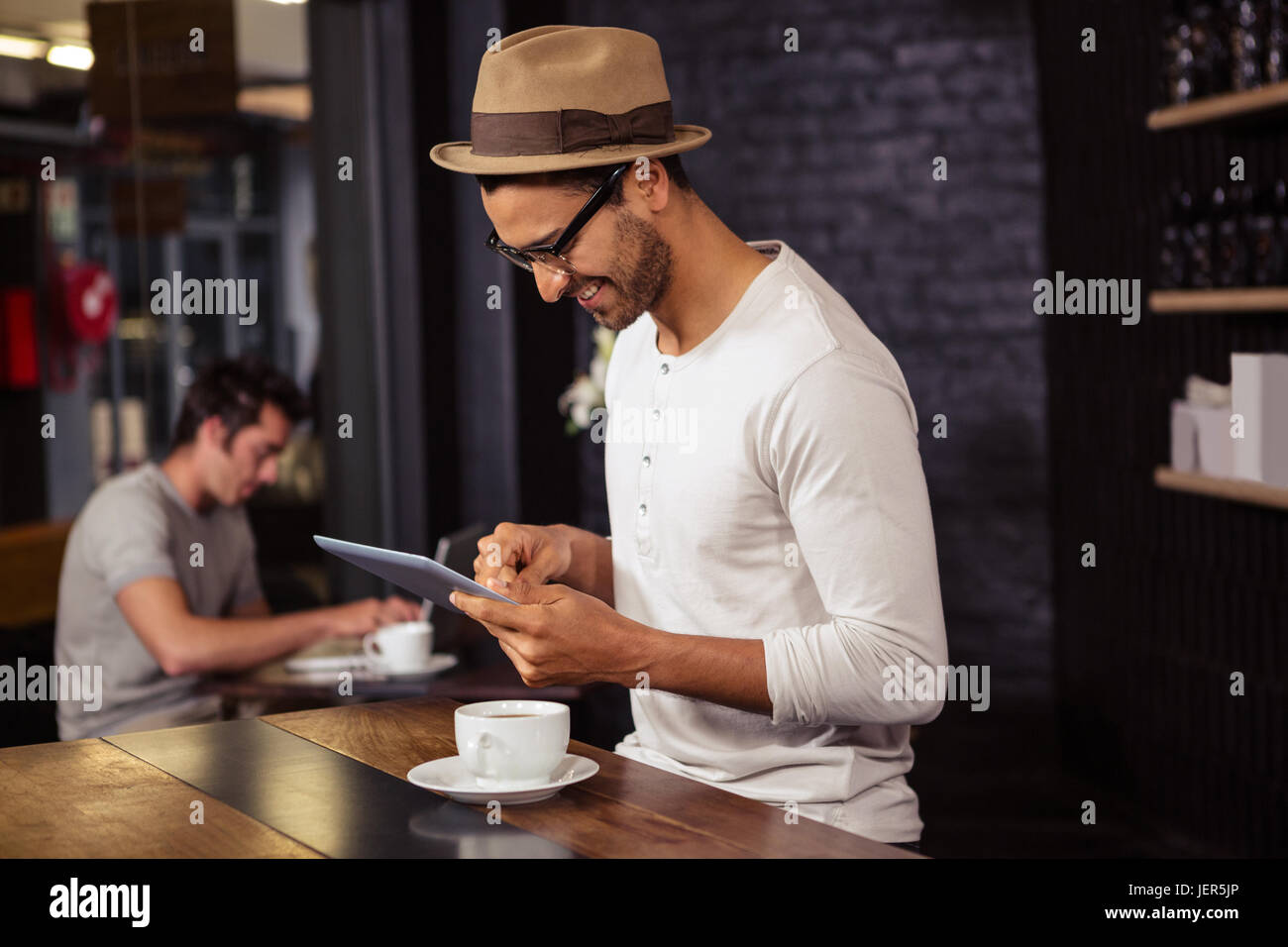 Man using a tablet Stock Photo - Alamy