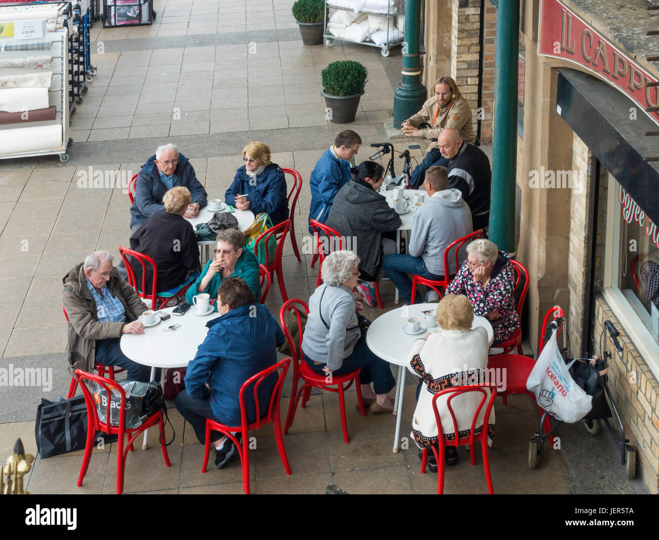 Shoppers resting and having refreshing drinks at the café in the Victorian Covered Market in Darlington Town Centre Stock Photo