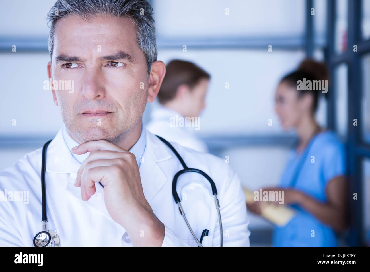 Thoughtful male medical intern hi-res stock photography and images - Alamy
