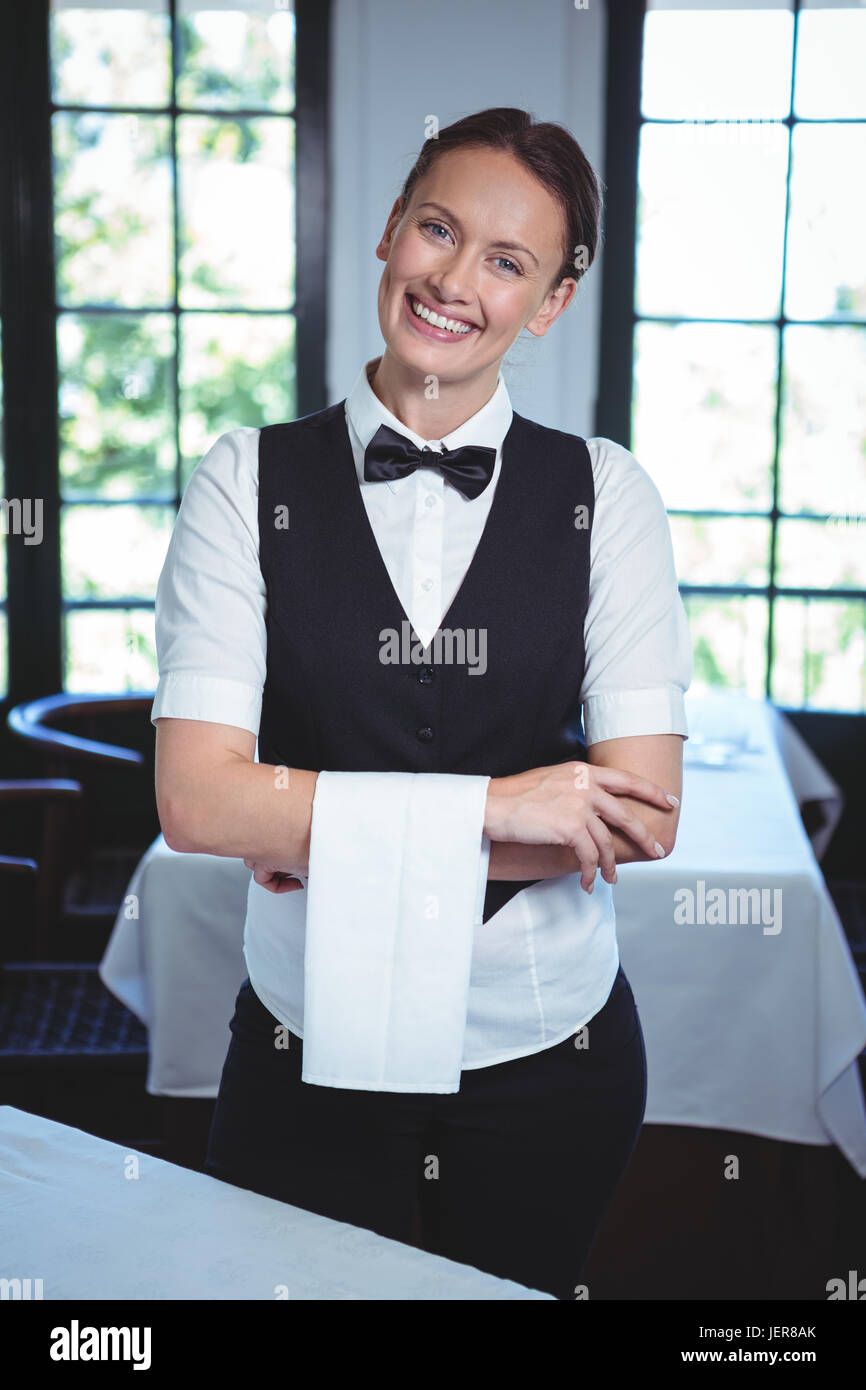 Smiling waitress crossed arms hi-res stock photography and images - Alamy