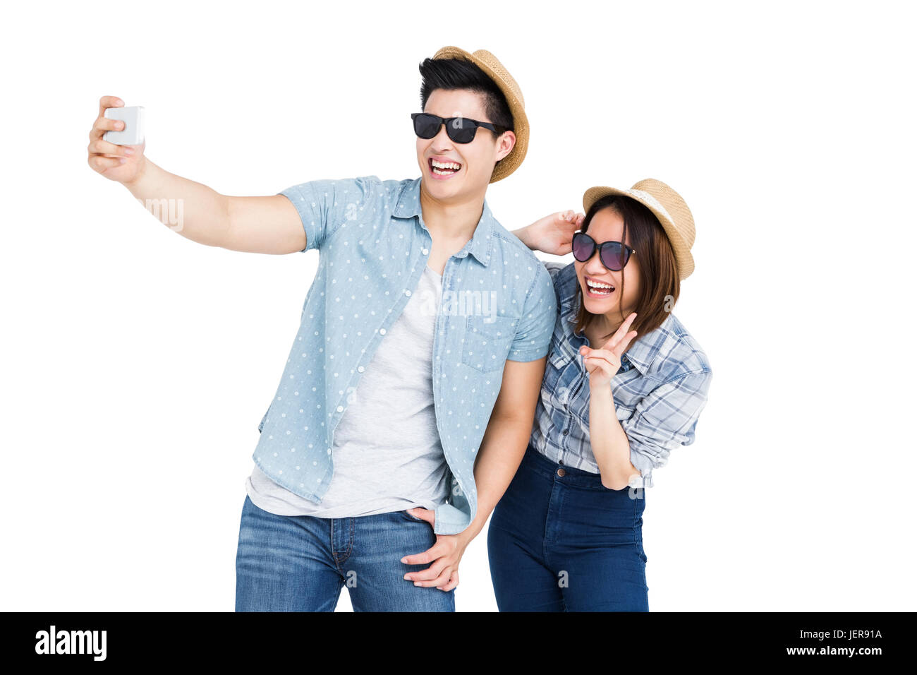 Happy young couple taking a selfie Stock Photo - Alamy