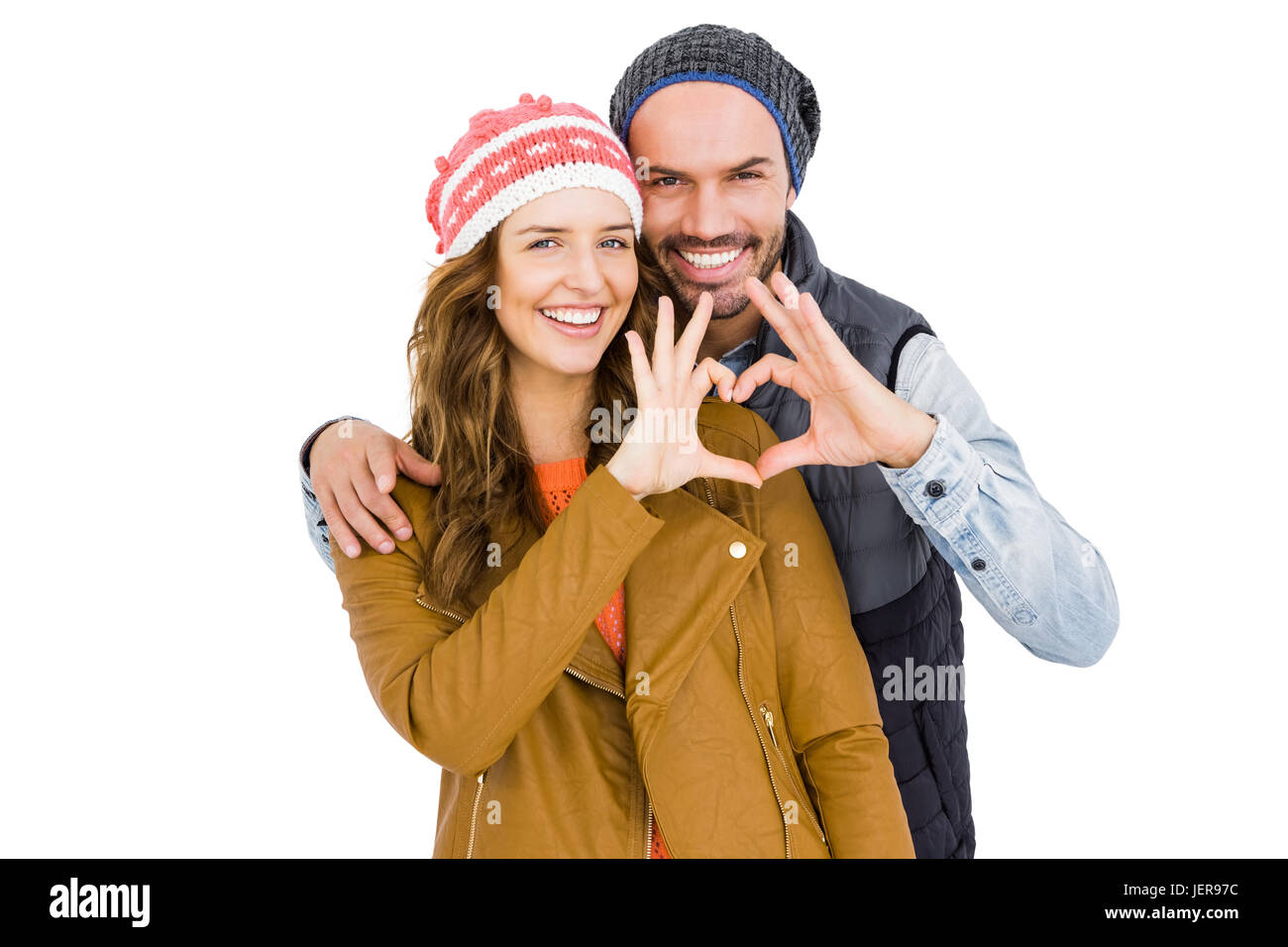 Happy young couple making heart gesture Stock Photo - Alamy