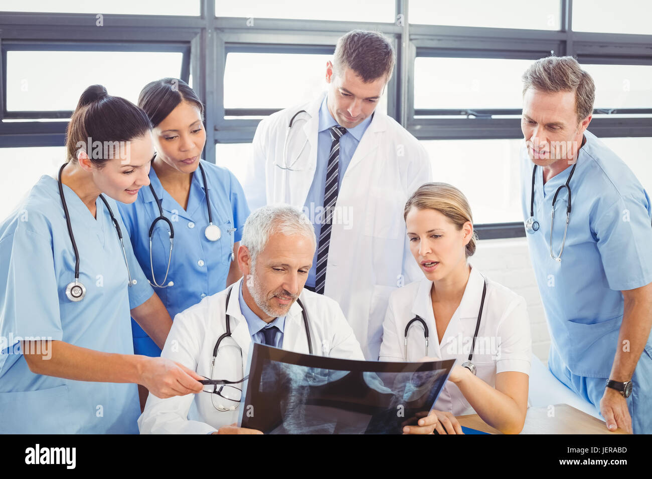 Medical team examining an x-ray report Stock Photo - Alamy