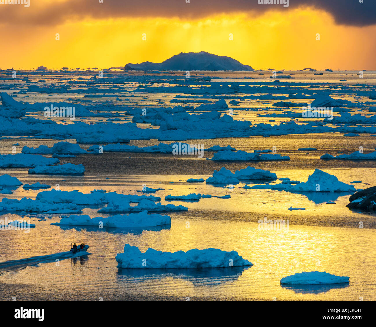 Icebergs at sunset Stock Photo - Alamy