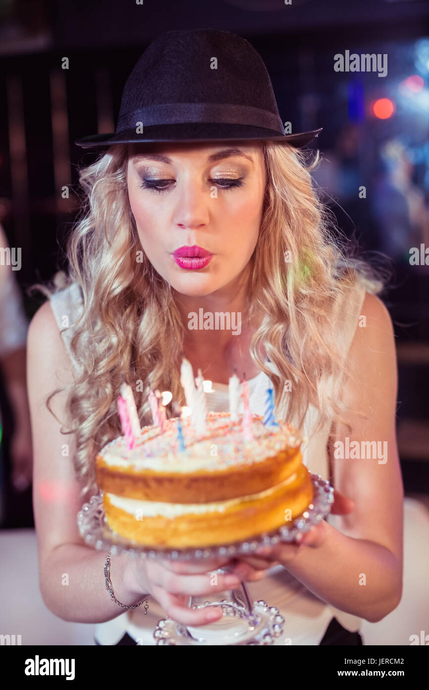 Woman blowing out candles Stock Photo Alamy