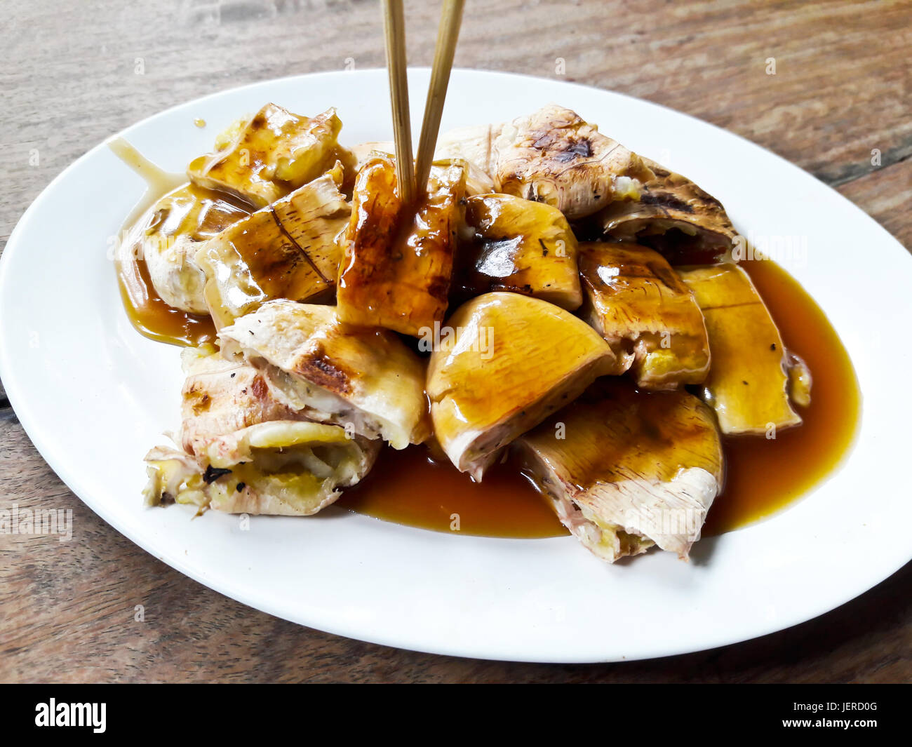Grilled bananas with sweet sauce Thai street food Stock Photo Alamy