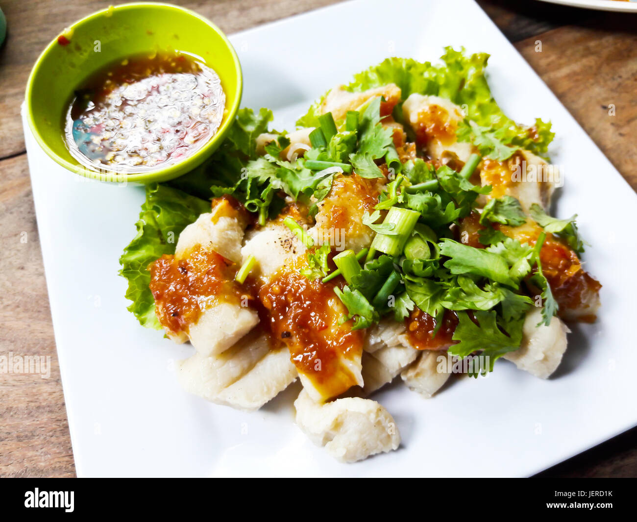 Boiled fish meat with spicy dip Stock Photo - Alamy