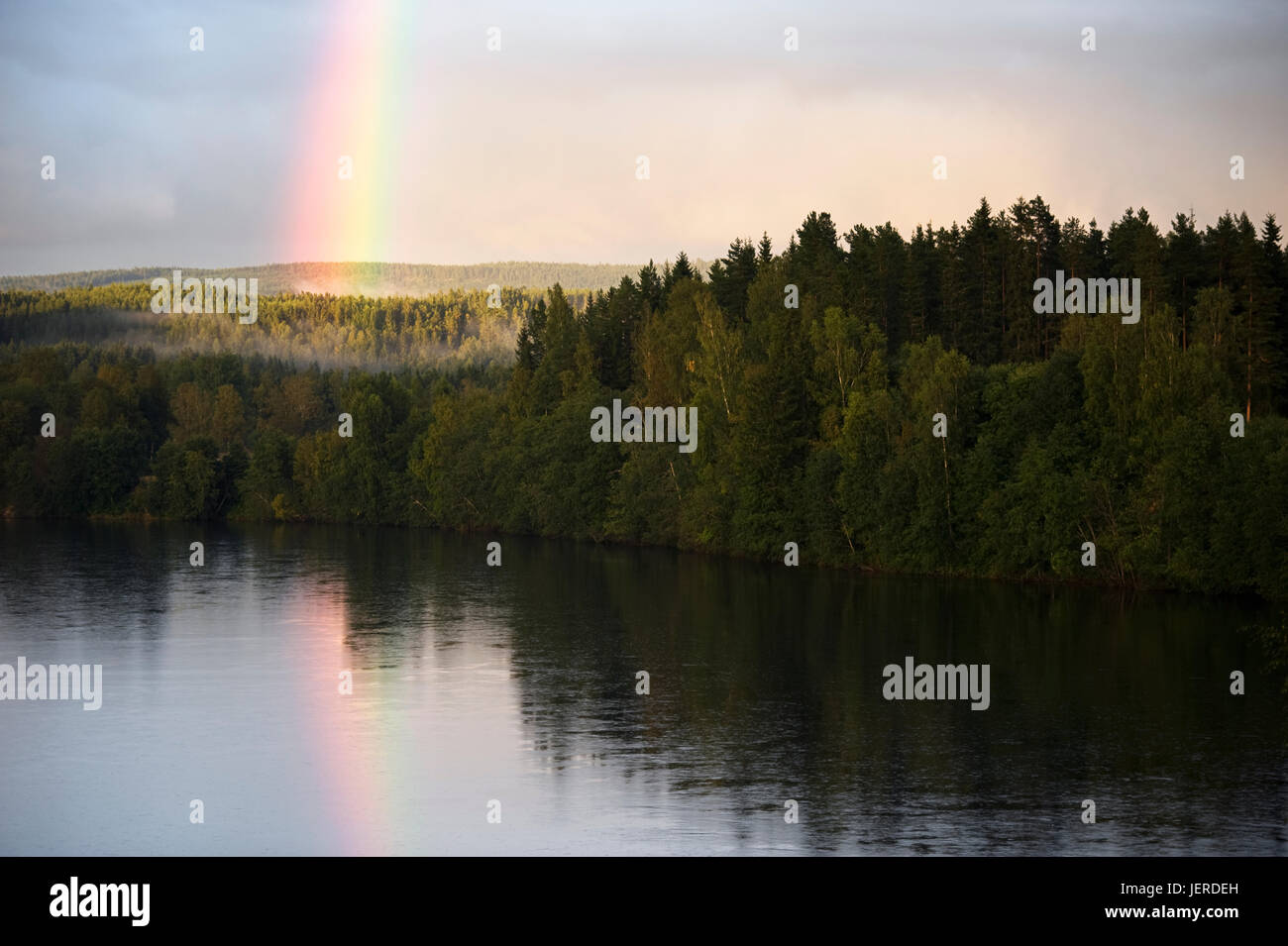 Rainbow above lake Stock Photo