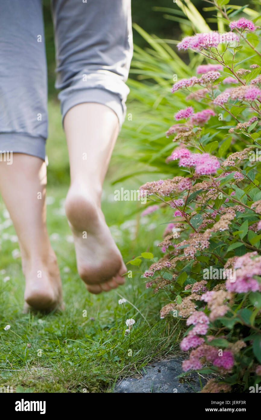 Woman walking barefoot grass garden hi-res stock photography and images ...