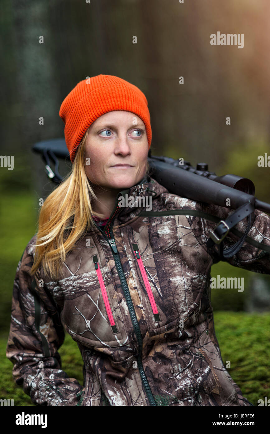 Woman hunting in forest Stock Photo Alamy